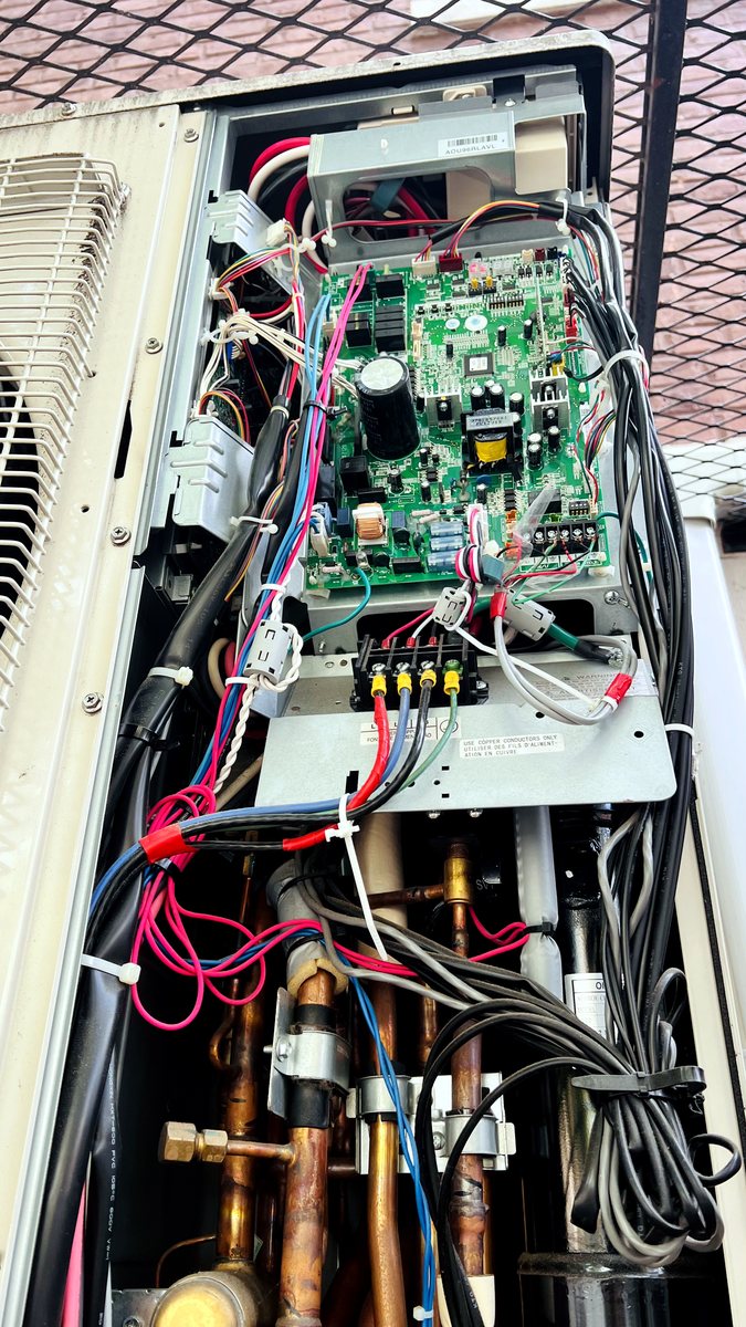 Open HVAC outdoor unit control board and wiring