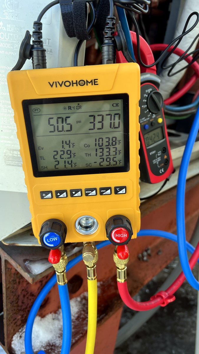 Digital HVAC manifold gauge showing pressure and temperature readings