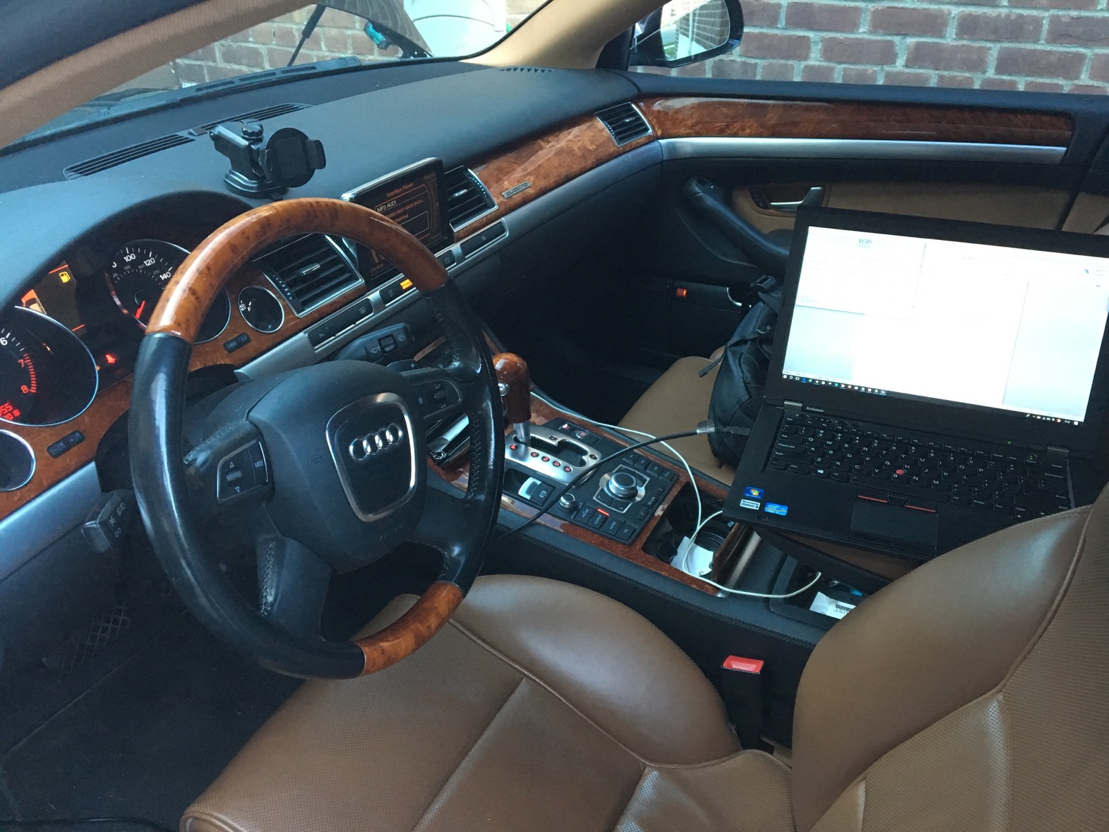 Automotive diagnostic laptop connected during climate-system testing