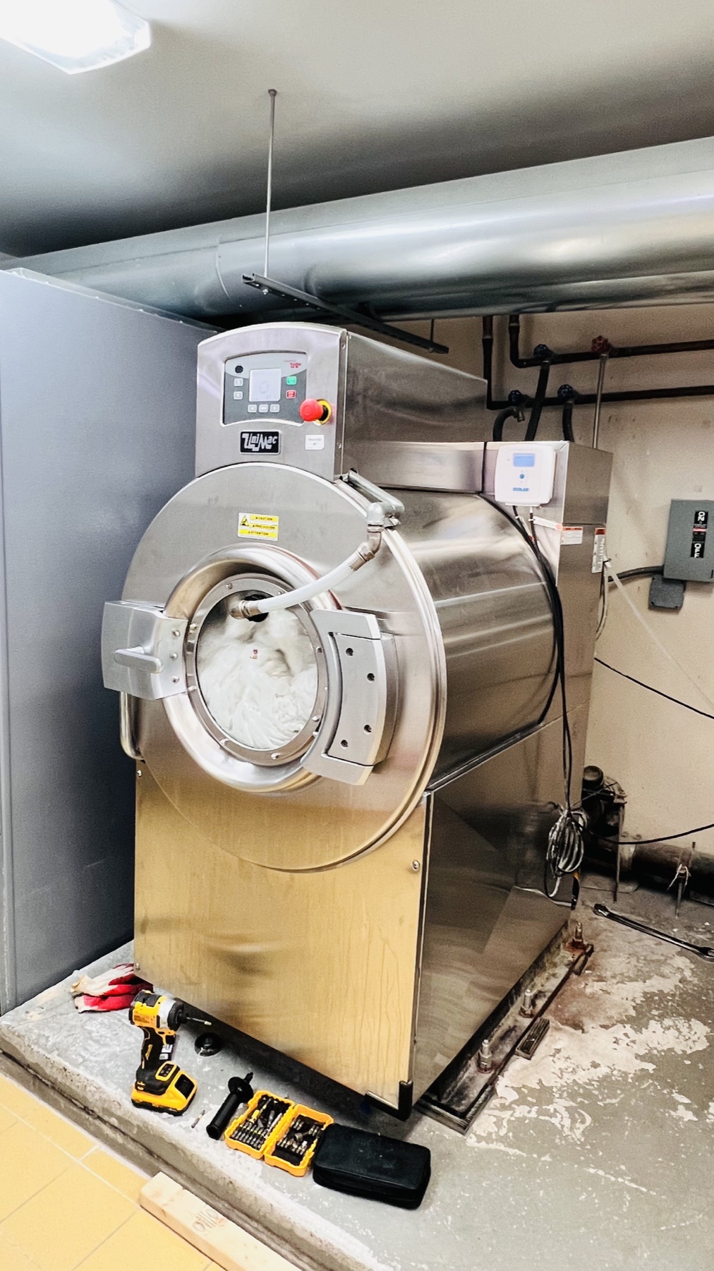 Tools arranged at the commercial washer during on-site service