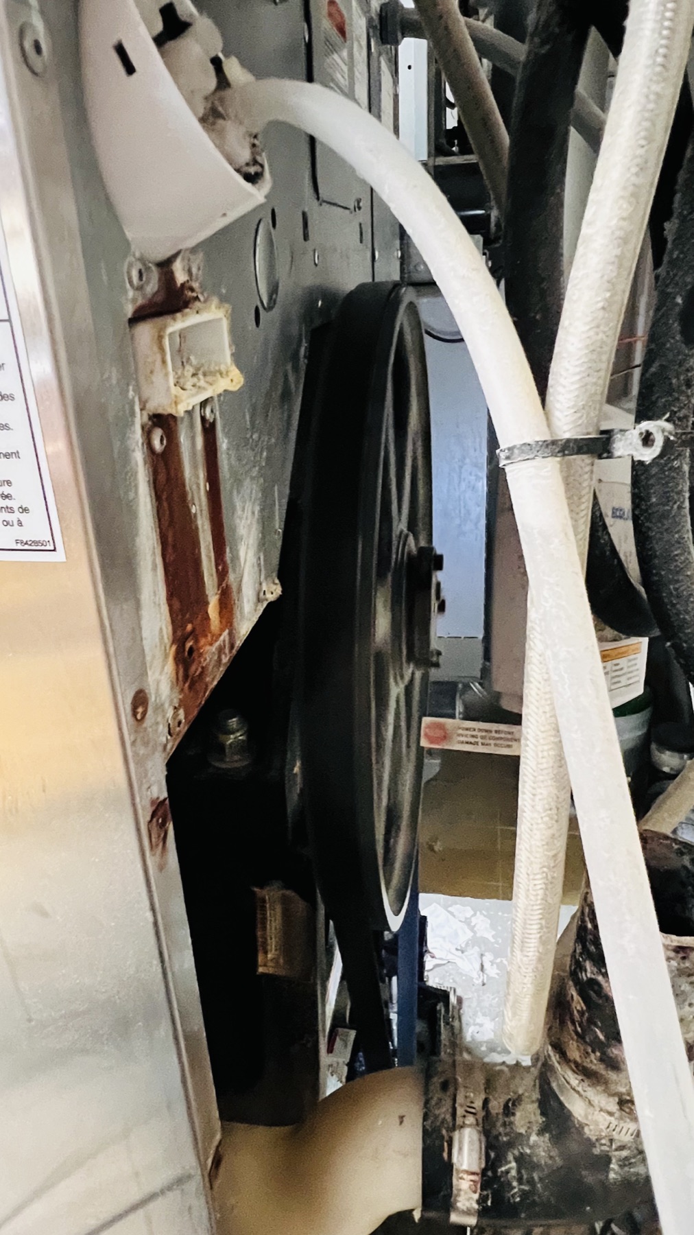 Commercial washer belt pulley and internal drive system during inspection