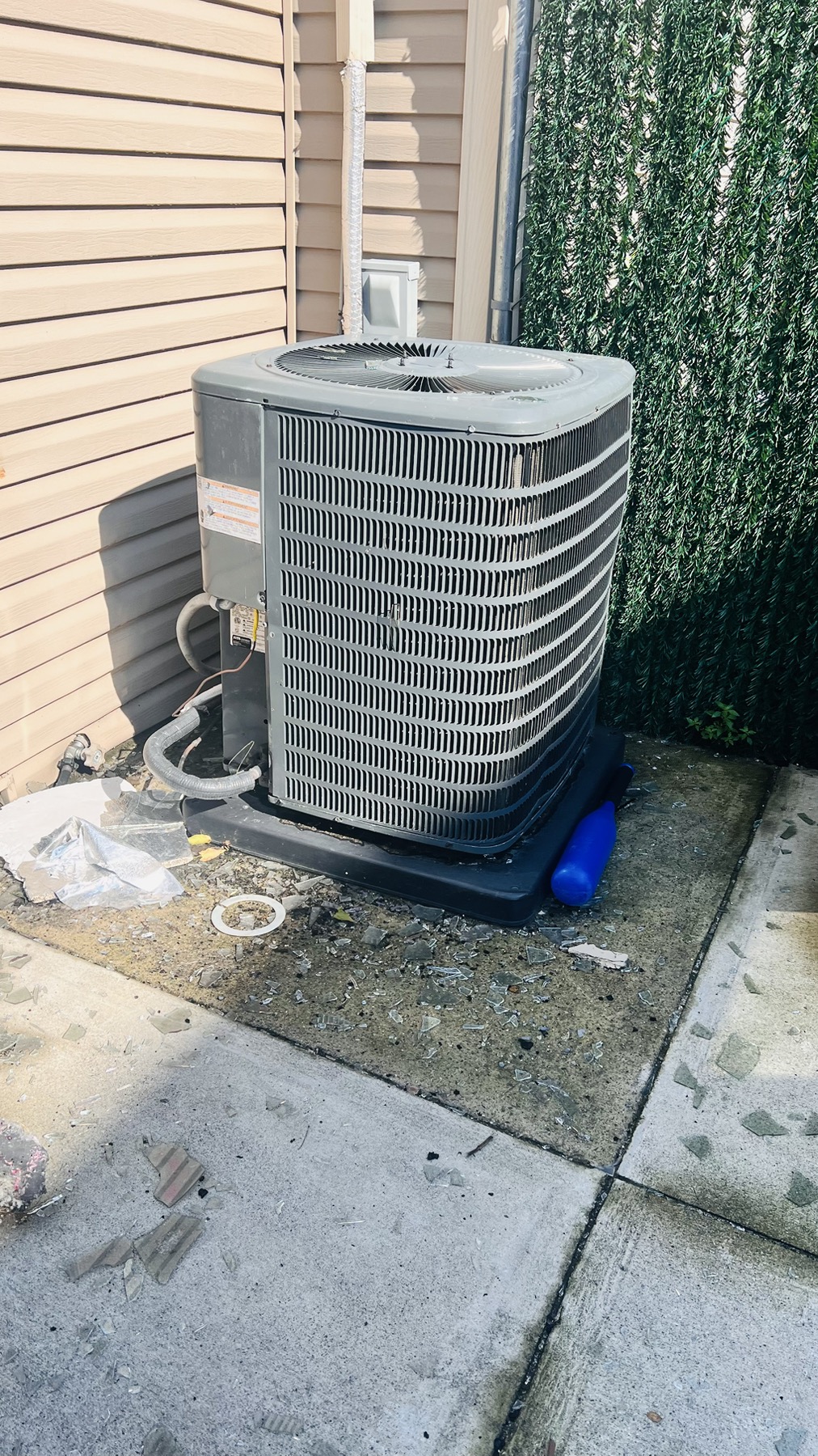 Outdoor home air-conditioning condenser during field inspection